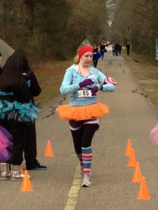 Kaitlyn finishing ahead of me - you can see my blue tutu behind her